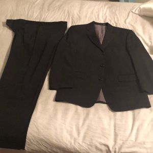 Two piece suit 100% wool. Black. Immaculate
